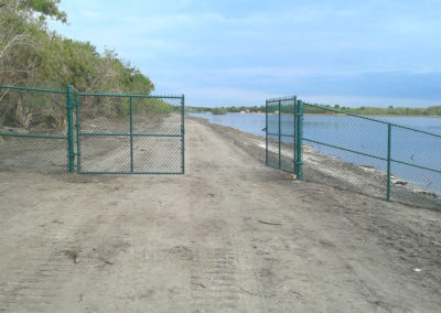 A green aluminum fence